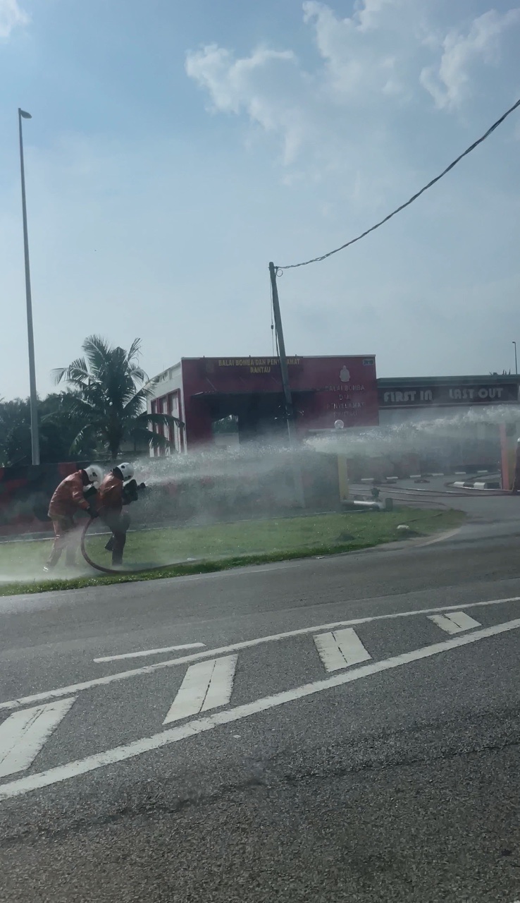 Two firefighter playing with water