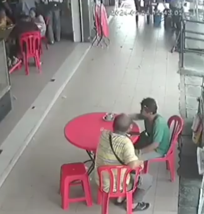 Two men having coffee at a kopitiam