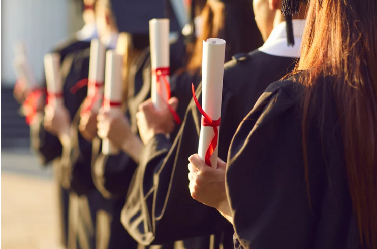 Uni graduates holding their scrolls