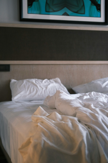unmade hotel bed