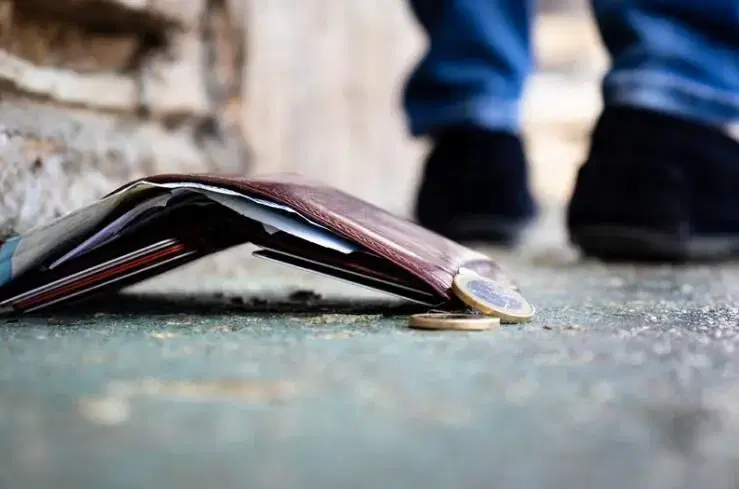 Wallet drops to the ground