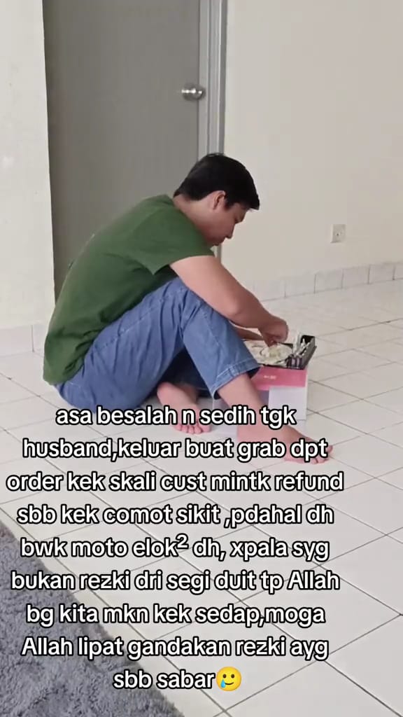 Msian man easting the cake alone after been rejected by a customer