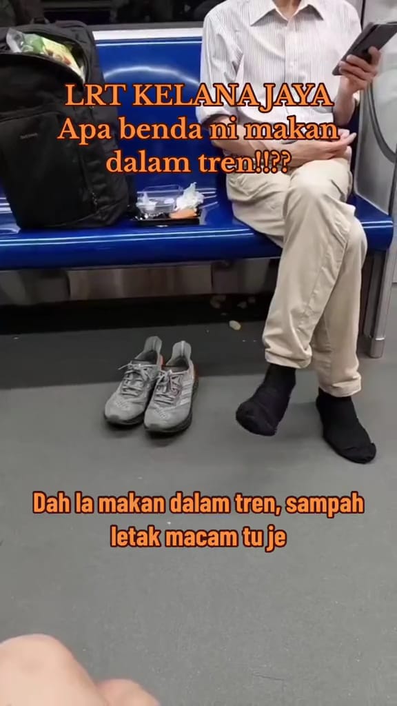 A msian man seen taking out his shoes at a lrt train.