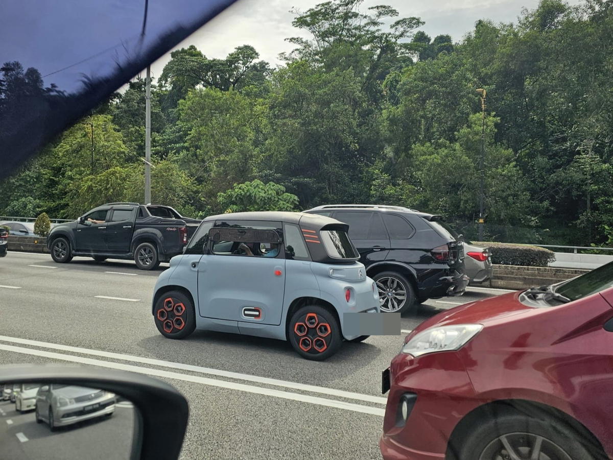 A blue citroen ami spotted on a road jalan duta.