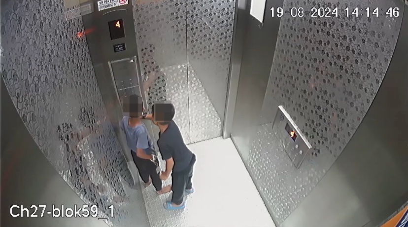 Lift footage shows slipper placed between door was what caused 2 m'sian boys to be stuck for 9 hours