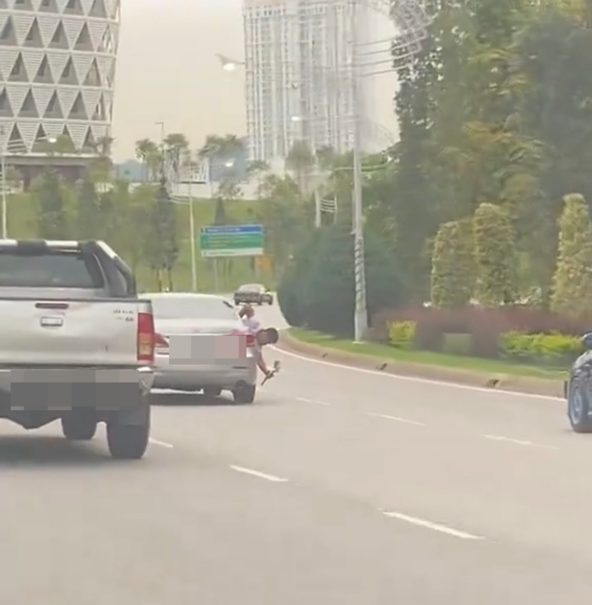 M’sian man leans out of moving car to film honda city