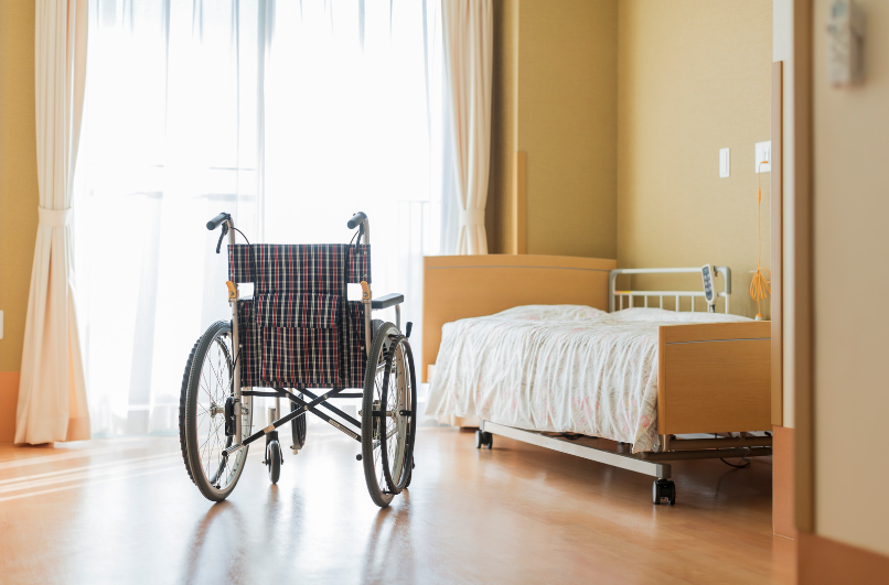 Wheelchair and bed at a nursing home