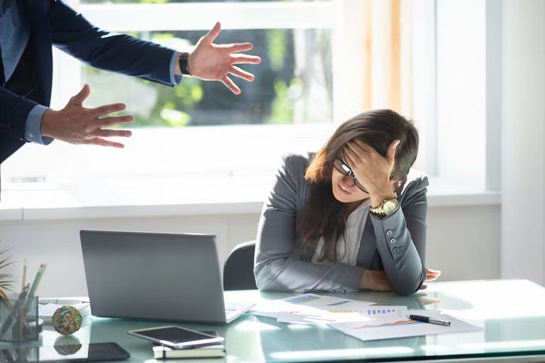 Woman at workplace stressed