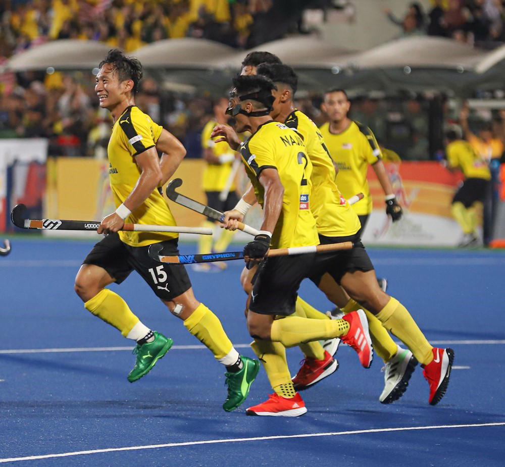 Malaysian hockey team celebrate