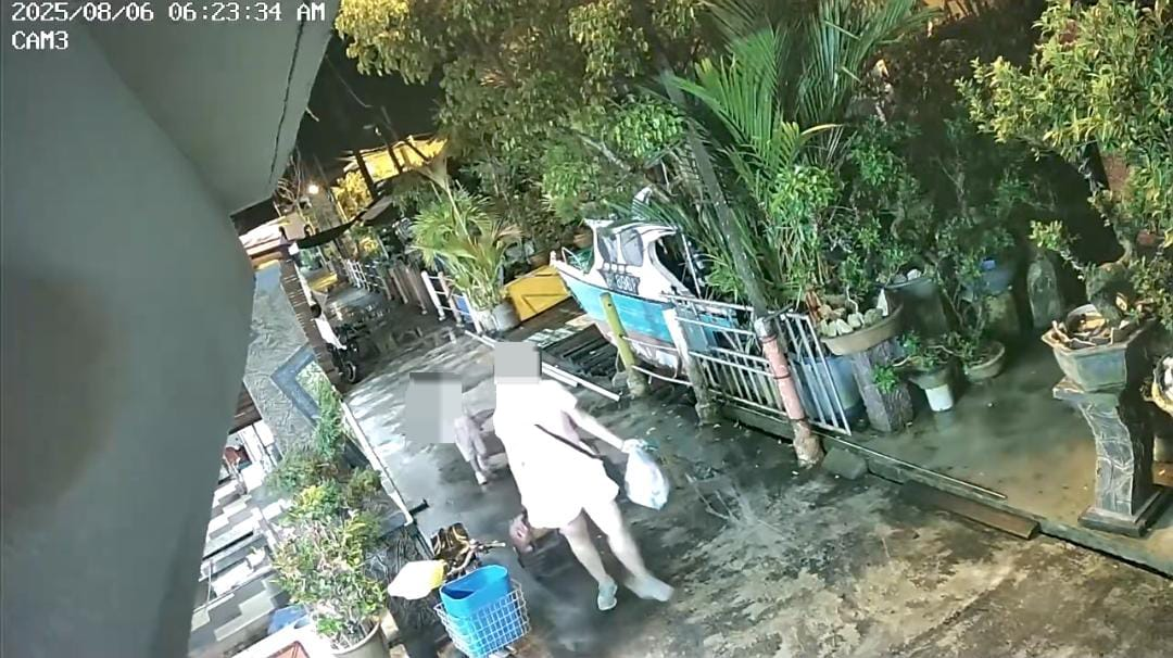 Woman and daughter carrying luggage before Pulau Ketam drowning