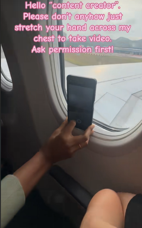Woman annoyed by passenger invading her personal space