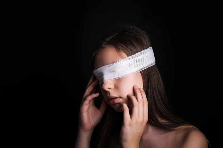 Woman blindfolded with handkerchief