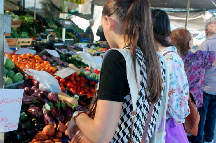 Woman buying vegetables at the market