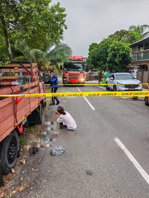 Woman crying beside body of man crushed between 2 vehicles