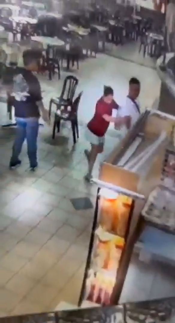 Woman drags man away from puchong food court