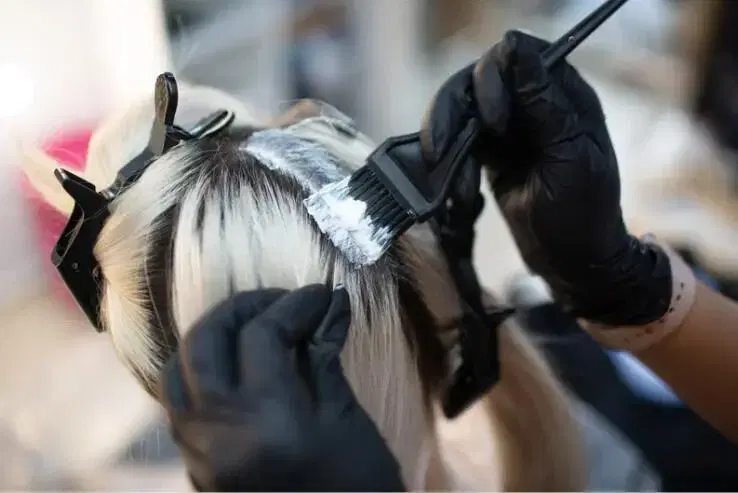 Woman getting her hair dyed