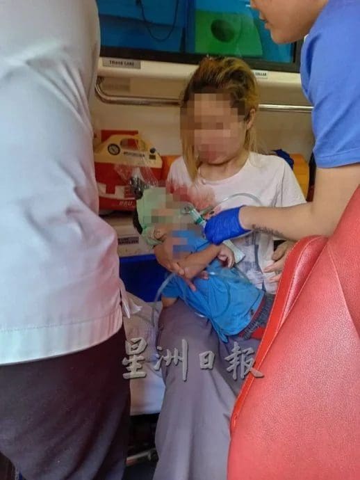 Woman holds son who fell from building in Sarawak