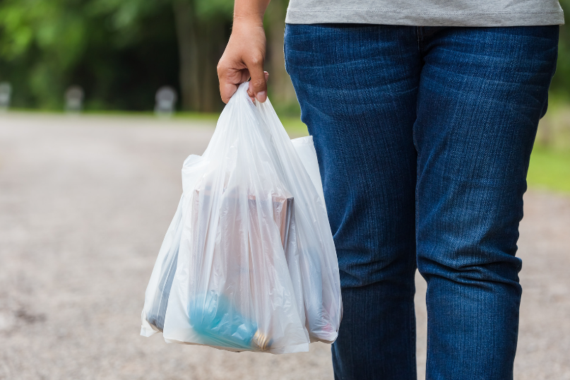 Woman holding a plastic bag