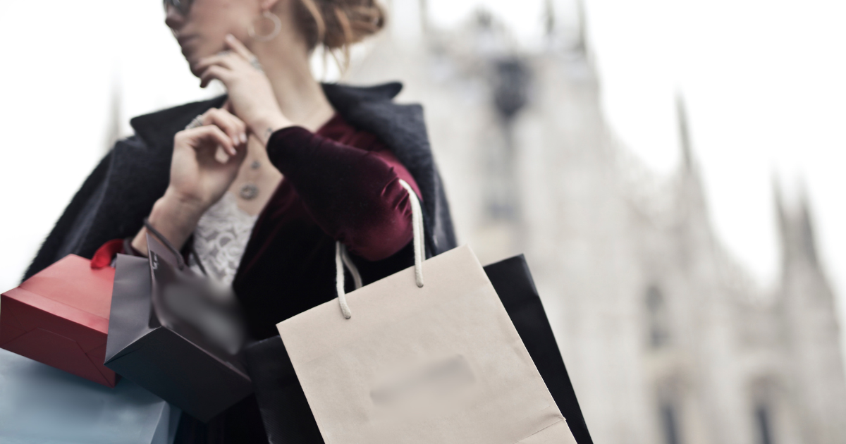 Woman holding handbags