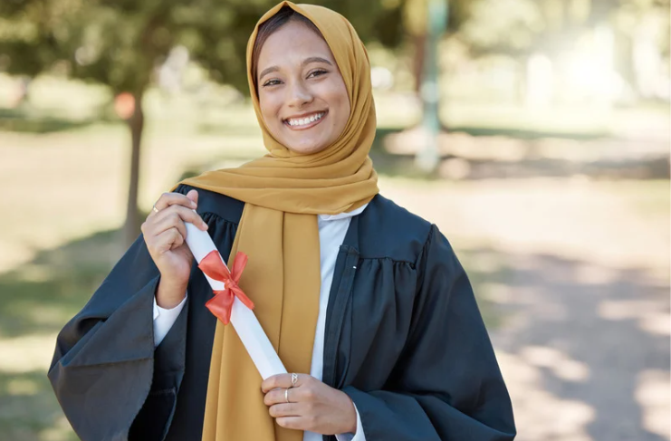 Woman holding her graduation scroll