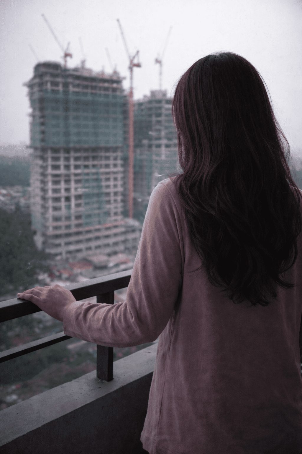 woman looking at under contrsuction building