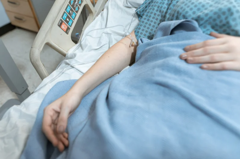 Woman on hospital bed