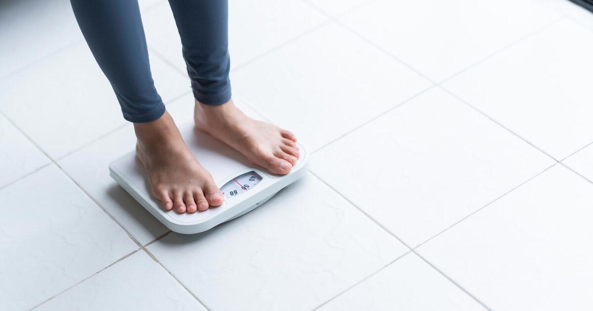 woman on weighing machine