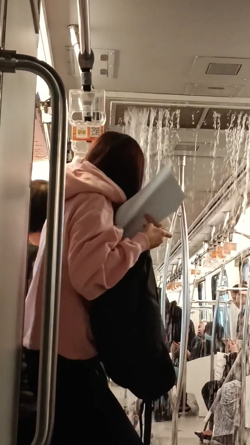 Woman running away from the pouring water in lrt