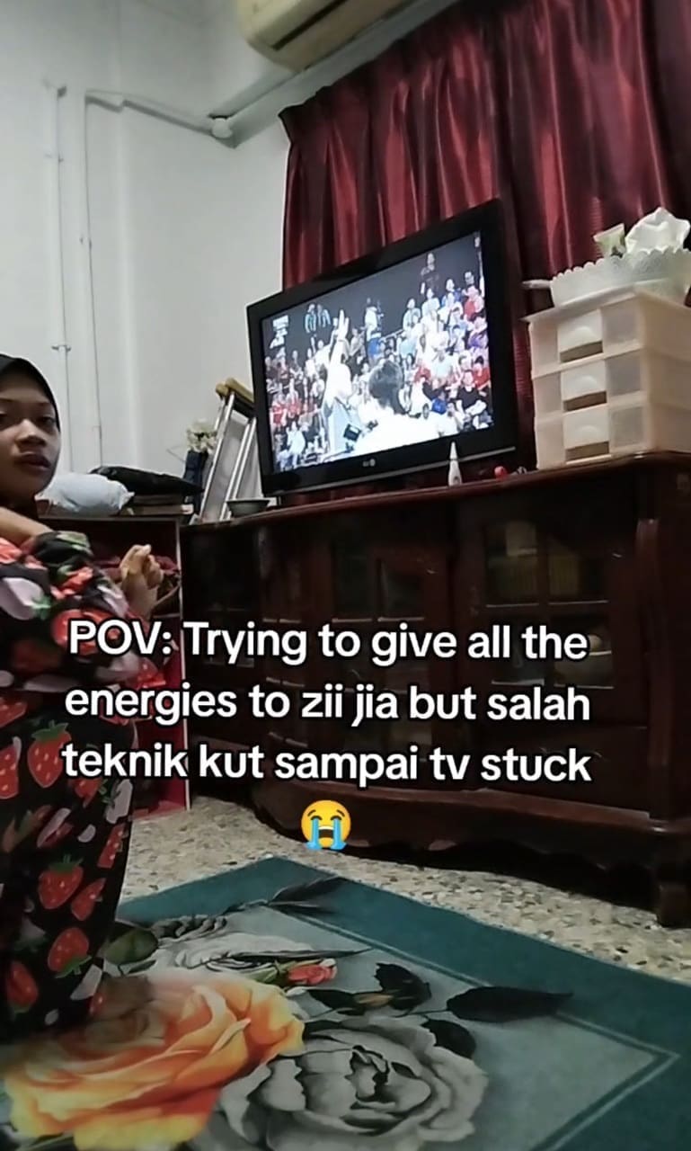 Woman shocked by the froze tv