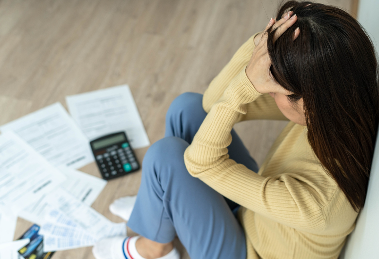 Woman stress after looking at the bills