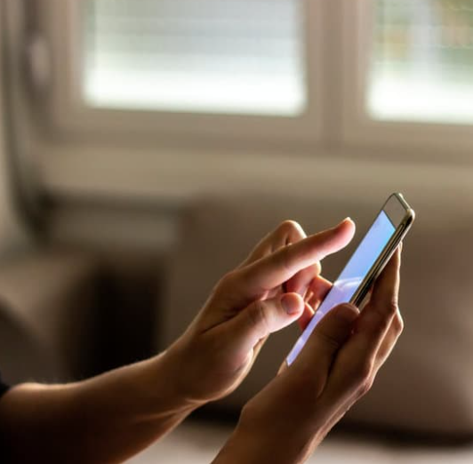 woman using handphone
