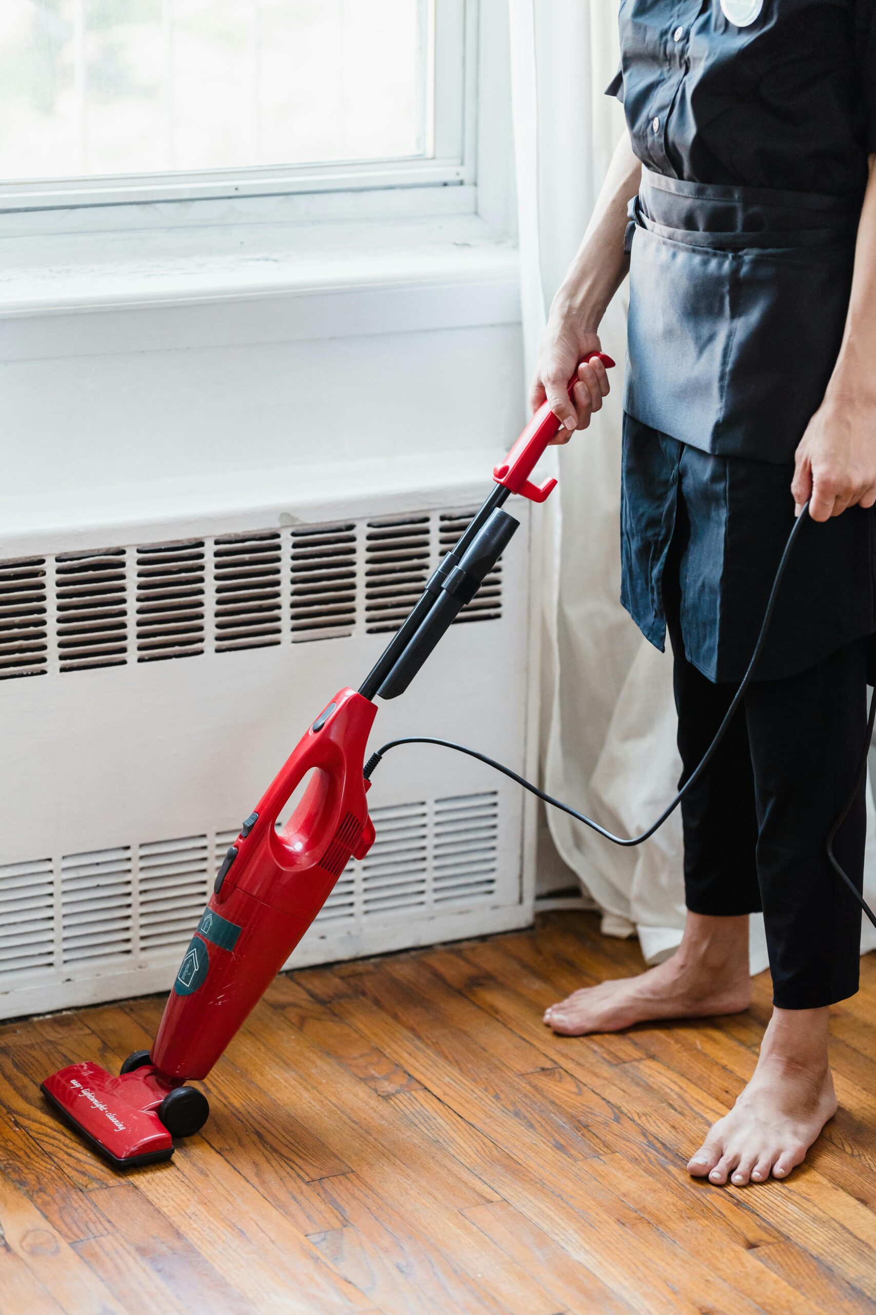 Woman vacuuming floor