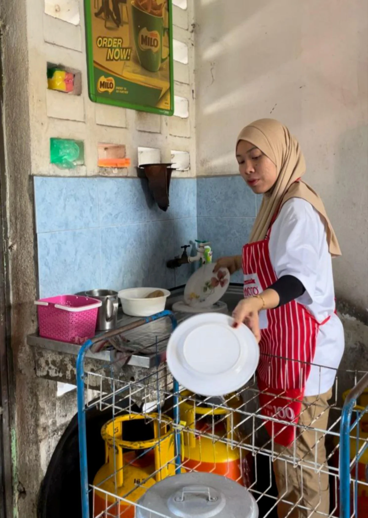 Woman washing dishes