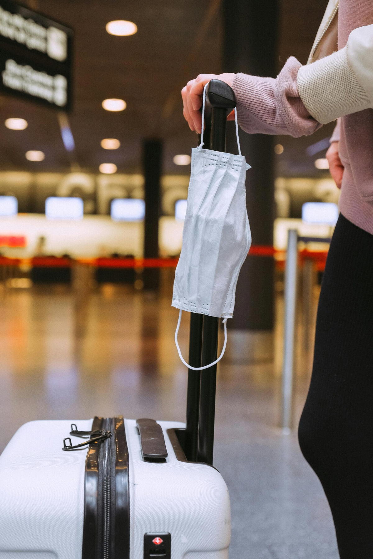 Woman with her luggage at the airport