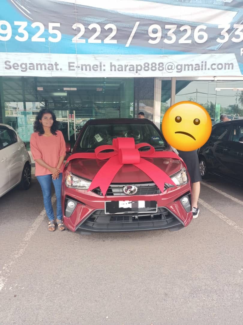 M'sian woman with her brand new perodua bezza