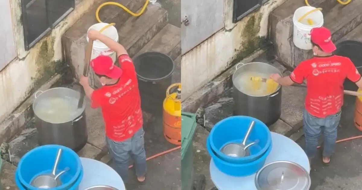 Worker cooking & touching spaghetti