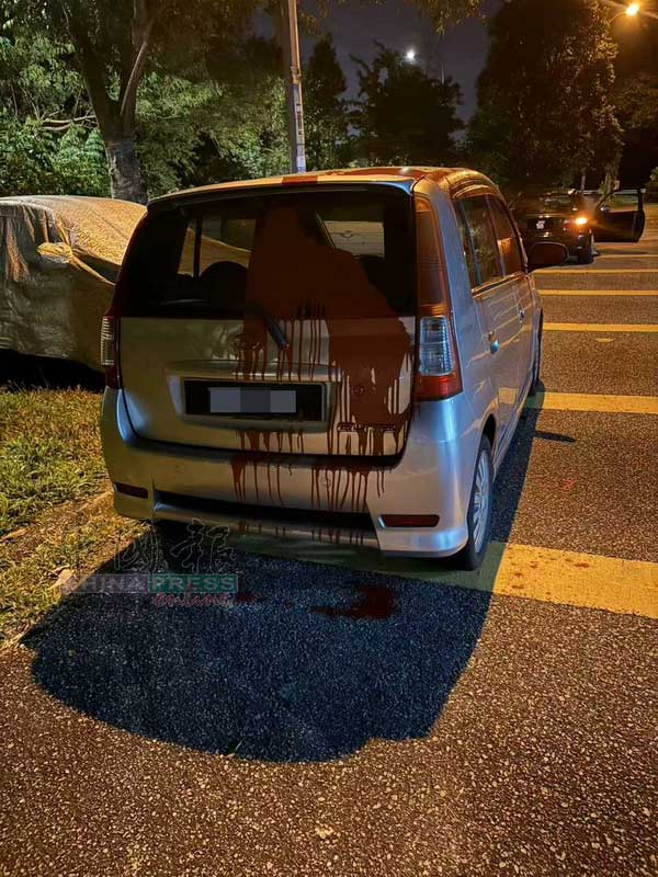 Xiao's car covered in red paint