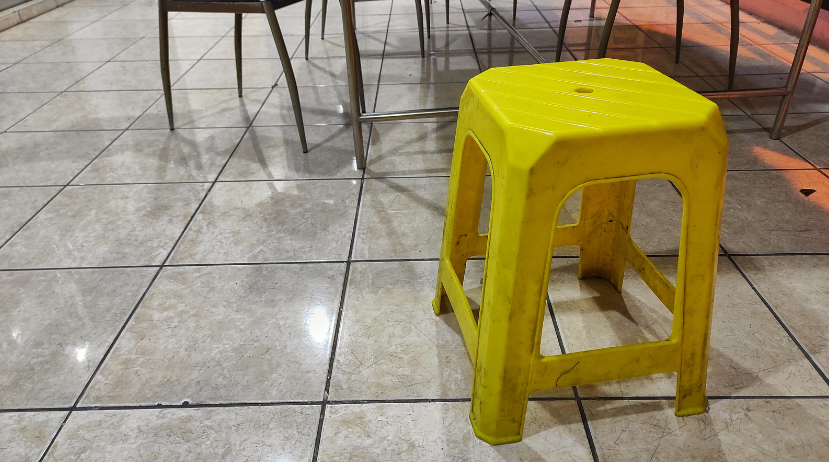 Yellow plastic stool