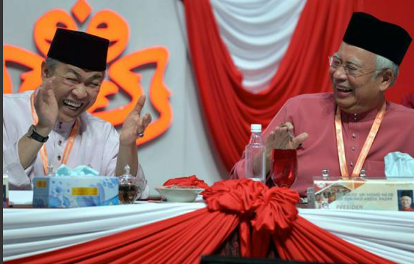 Political figures: najib razak with zahid hamidi at umno event.