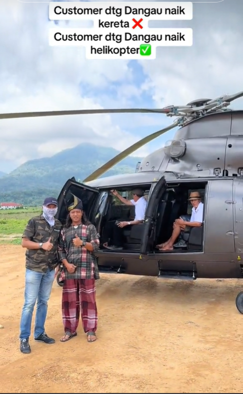 Zaidi hassan takes photo with man and helicopter