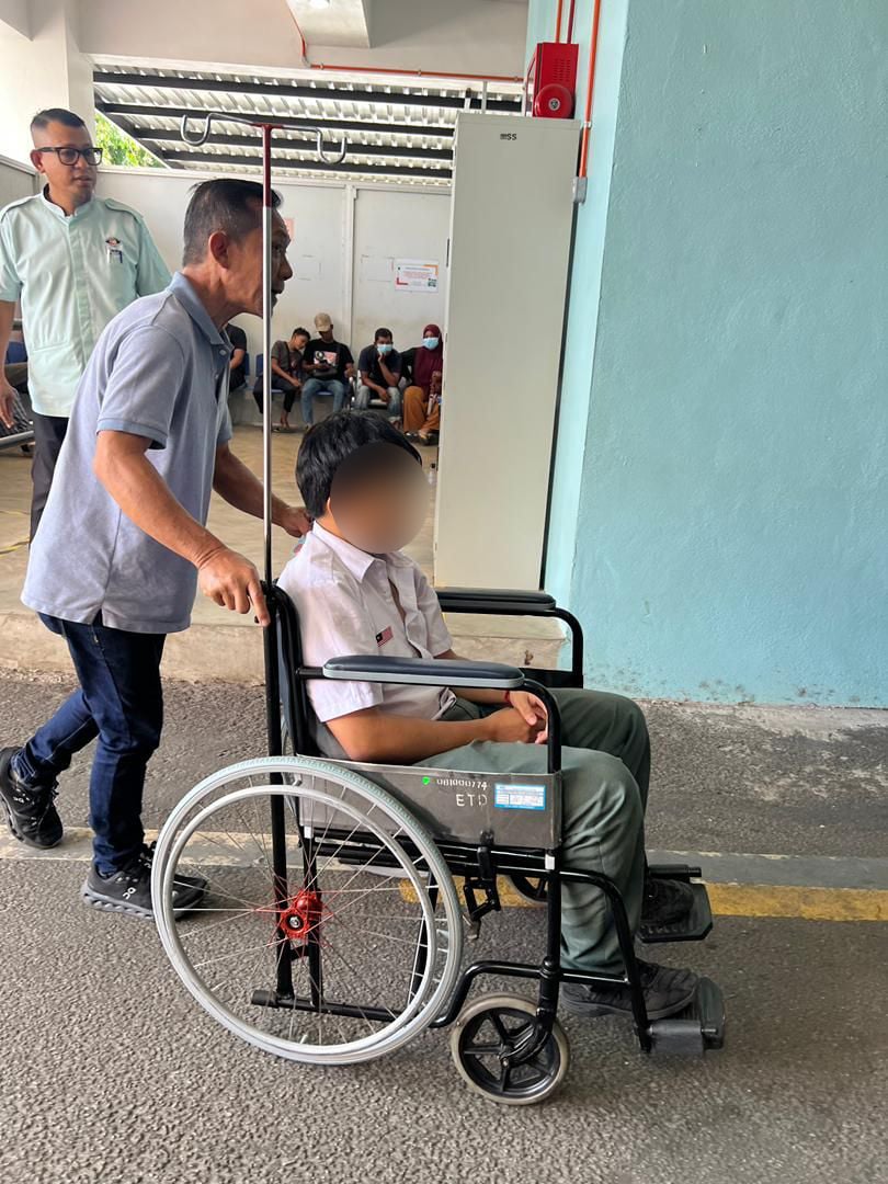 Zheng taking his son to the hospital